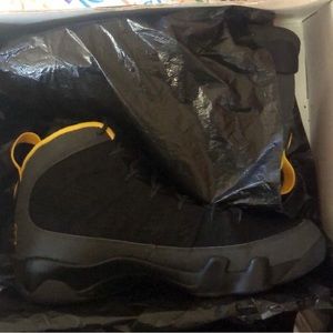 Black and gold Jordan 9’s